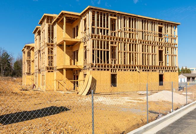 construction zone secured with a temporary fence, marked with warning signs in Seabrook